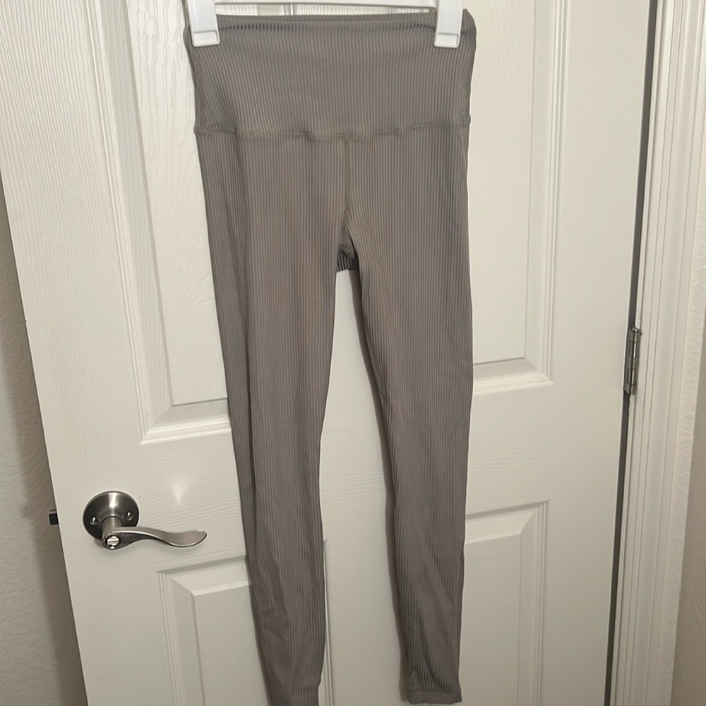 Tan + Lines sage green ribbed leggings.